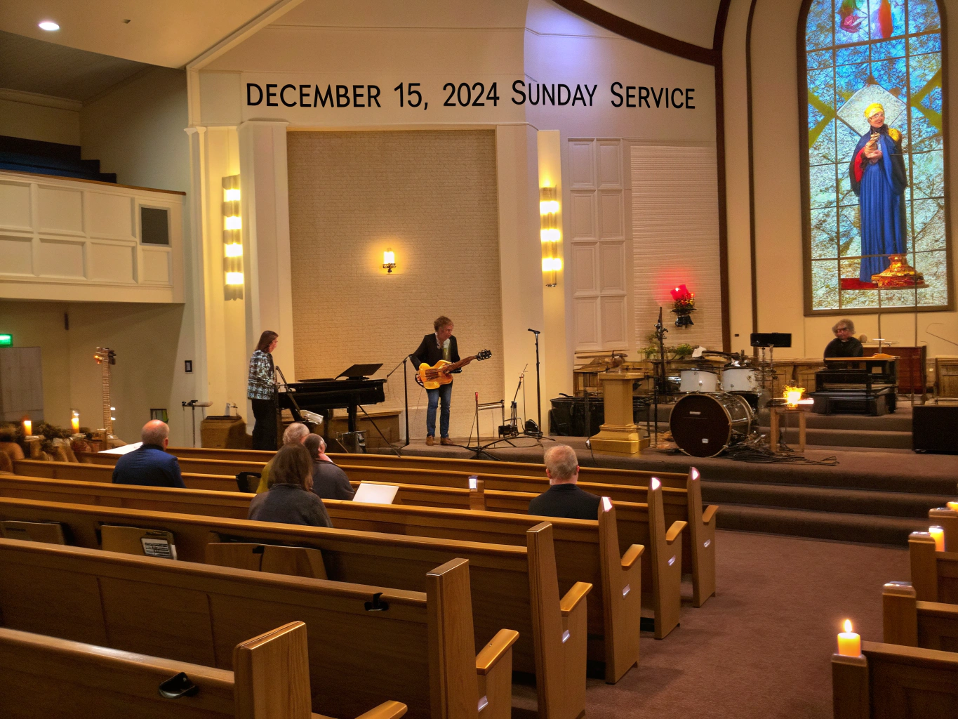 Acoustic guitar player and community in warm sanctuary lighting during prayer evening